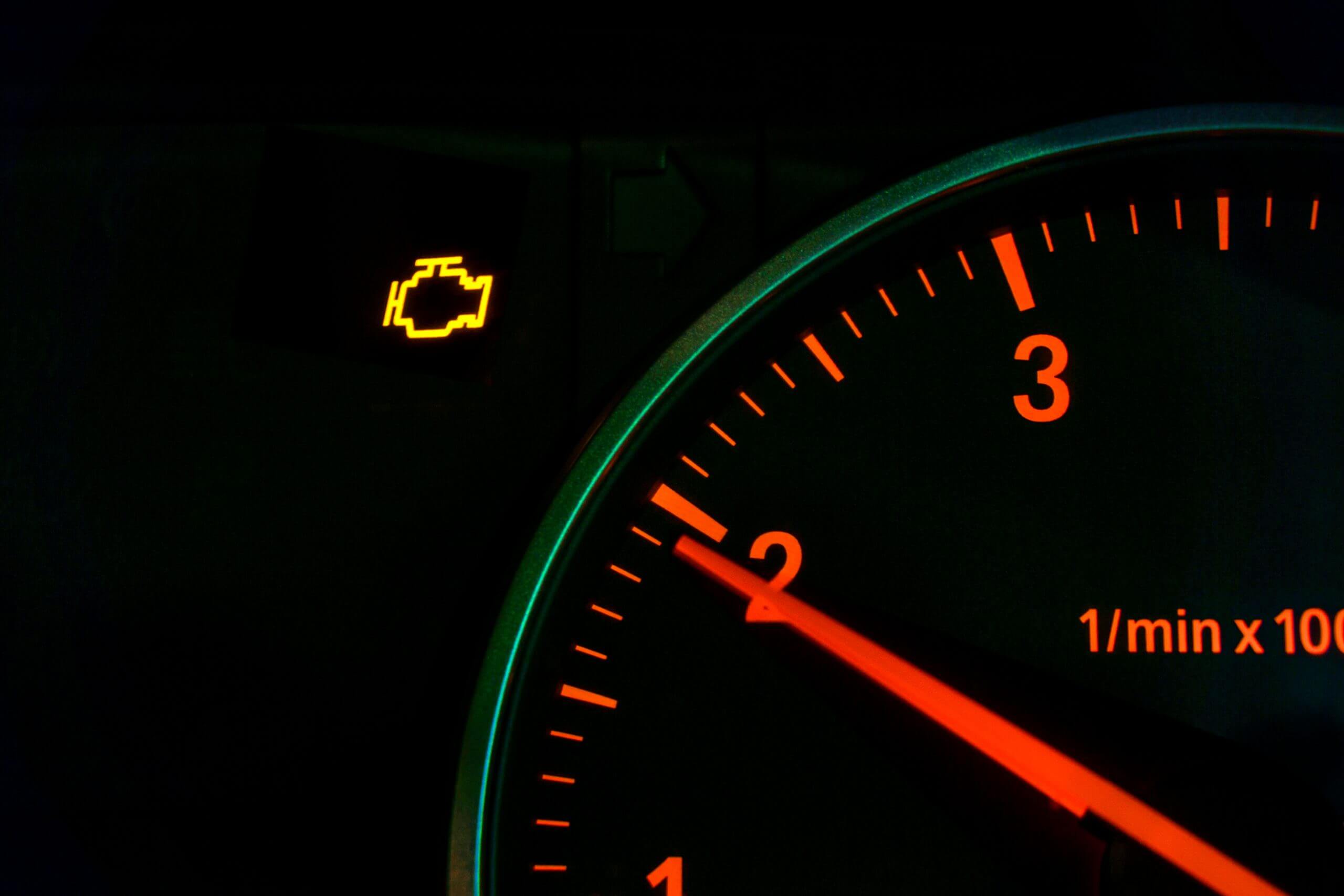 Engine malfunction warning light control in car dashboard.
