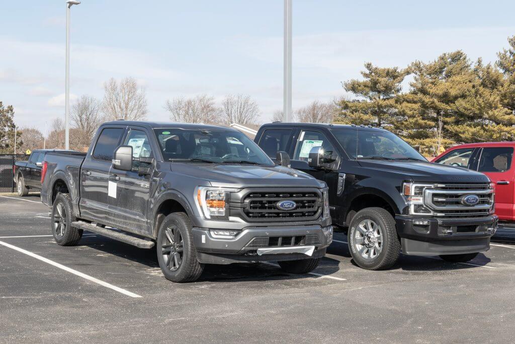 Kokomo - Circa February 2023: Ford F-150 and F-250 truck display at a dealership. The Ford Super Duty F-Series truck is among the best-selling in the US.
