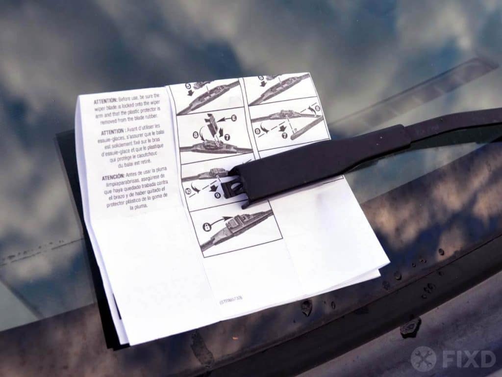 Lower wiper arm and use paper or rag to protect glass