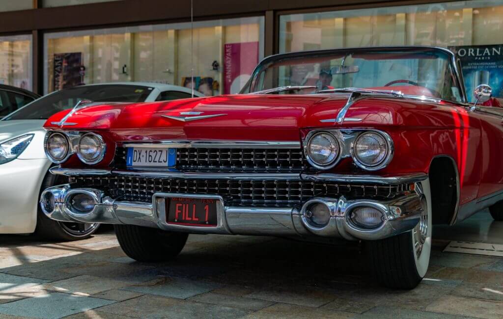 A picture of the front side of a red Cadillac 1959 Series 62 Convertible.