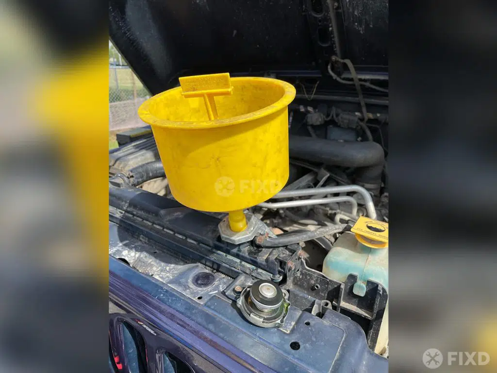 use a funnel to fill radiator with new engine coolant