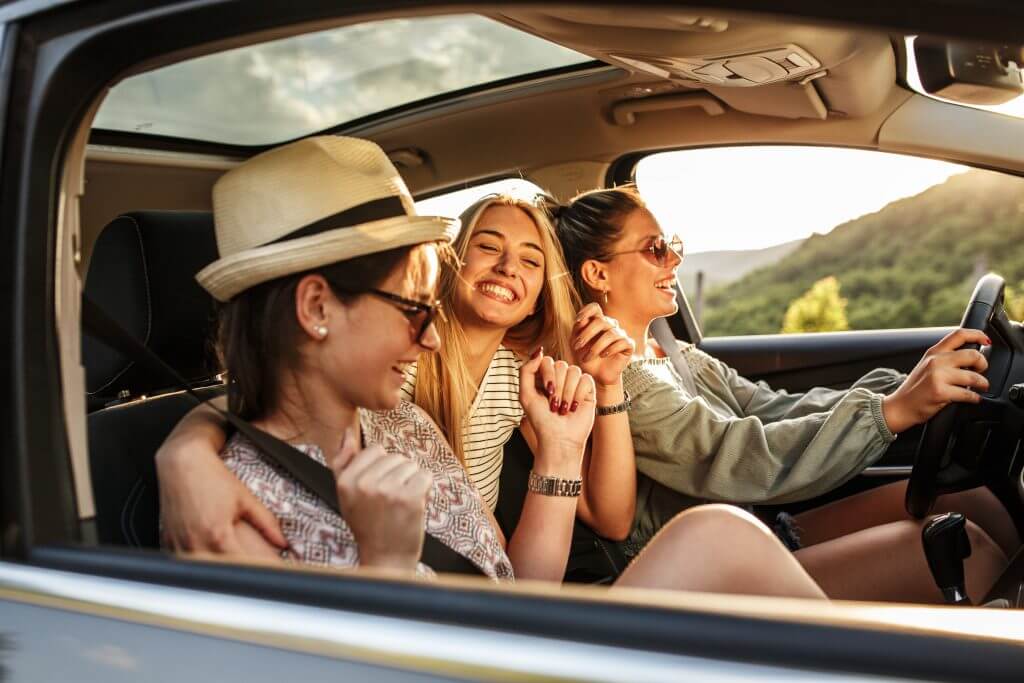 Group of best female friends travel together by car