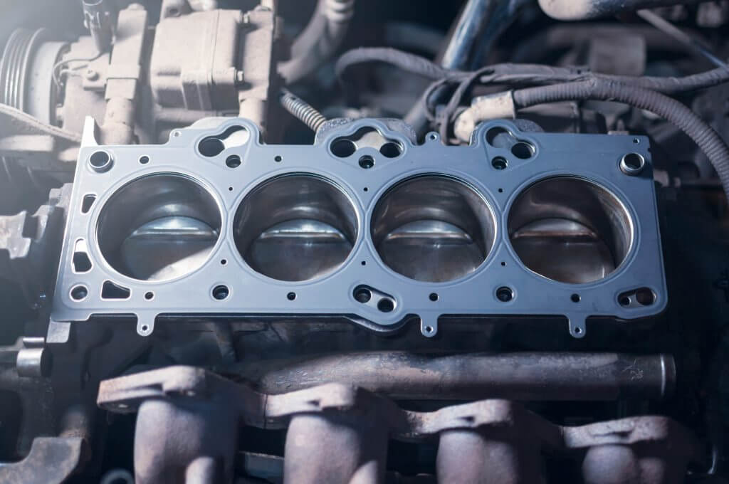 Car engine repair. cylinder head gasket replacement in the workshop
