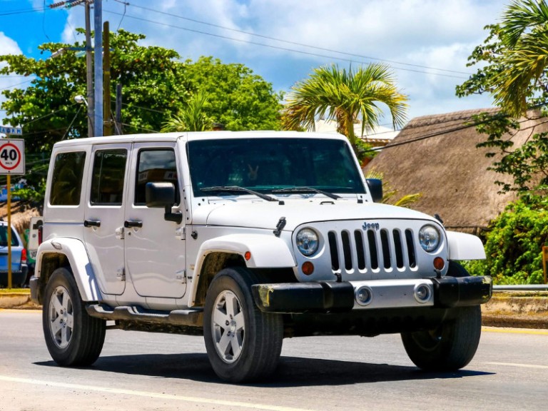 Motor car Jeep Wrangler in the city street.