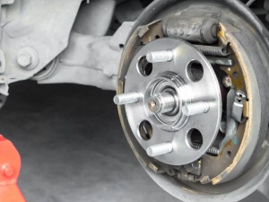 New rear wheels car bearing for drum brake type bearing on replacement service in garage and copyspace