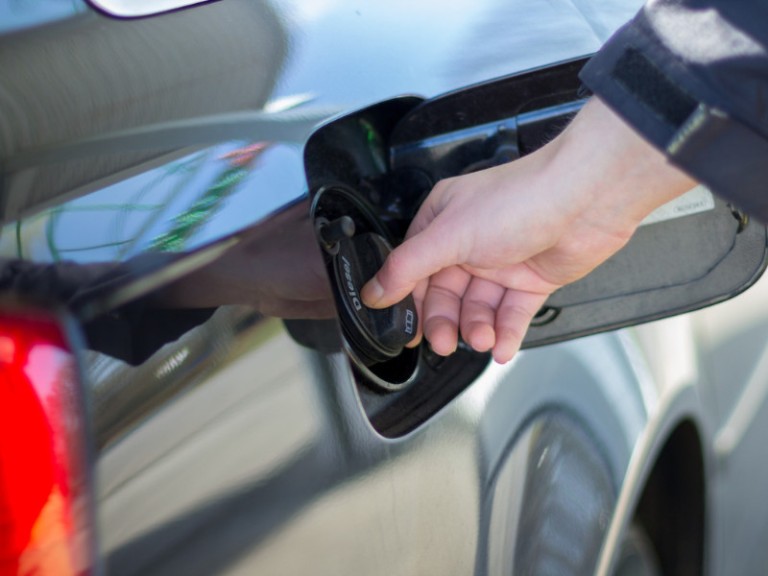 hand on a filler cap