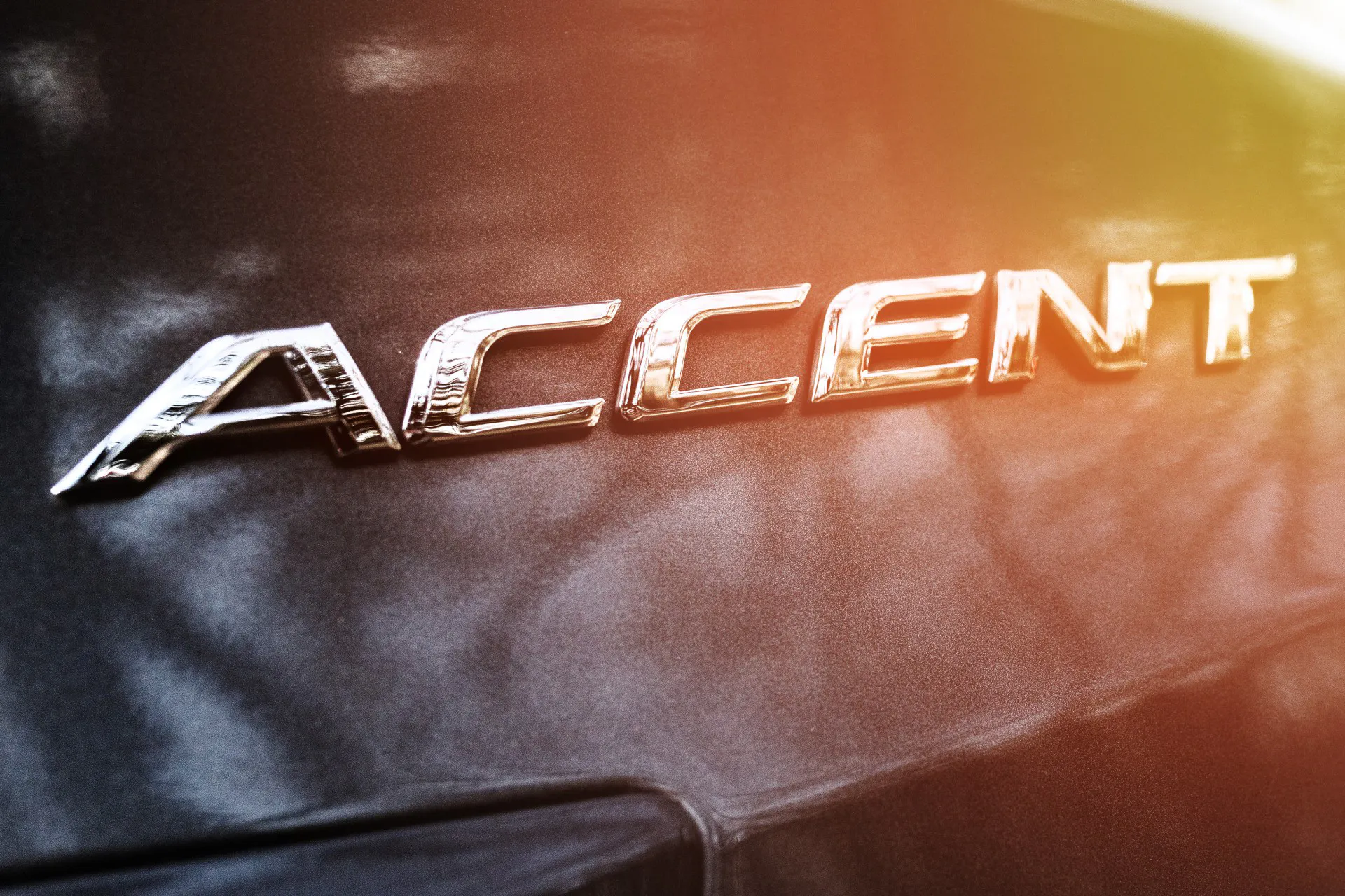 ACCENT logo on the trunk lid of a Hyundai car