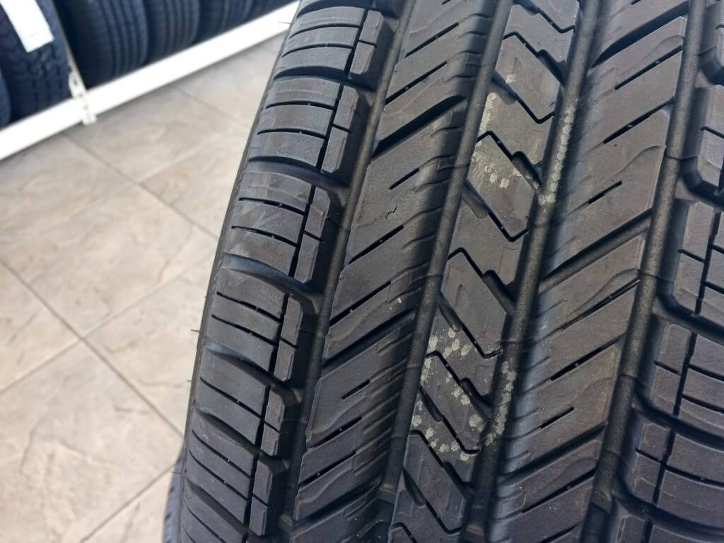 New tires in store on display by floor