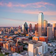 Dallas, Texas cityscape with blue sky at sunset in USA