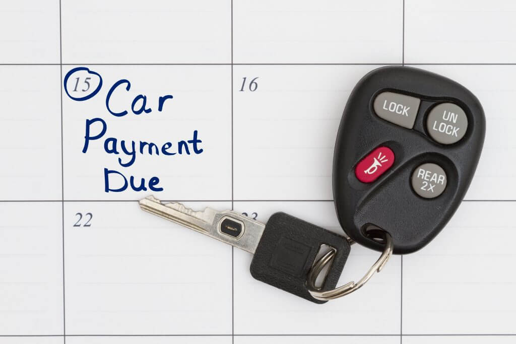 Keys on a calendar that reads "car payment due"