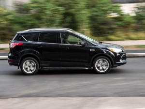 Black Ford Escape/Maverick car moving on the street