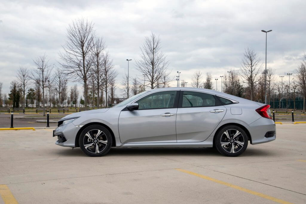 Silver Honda Car Parked at a Spacious area