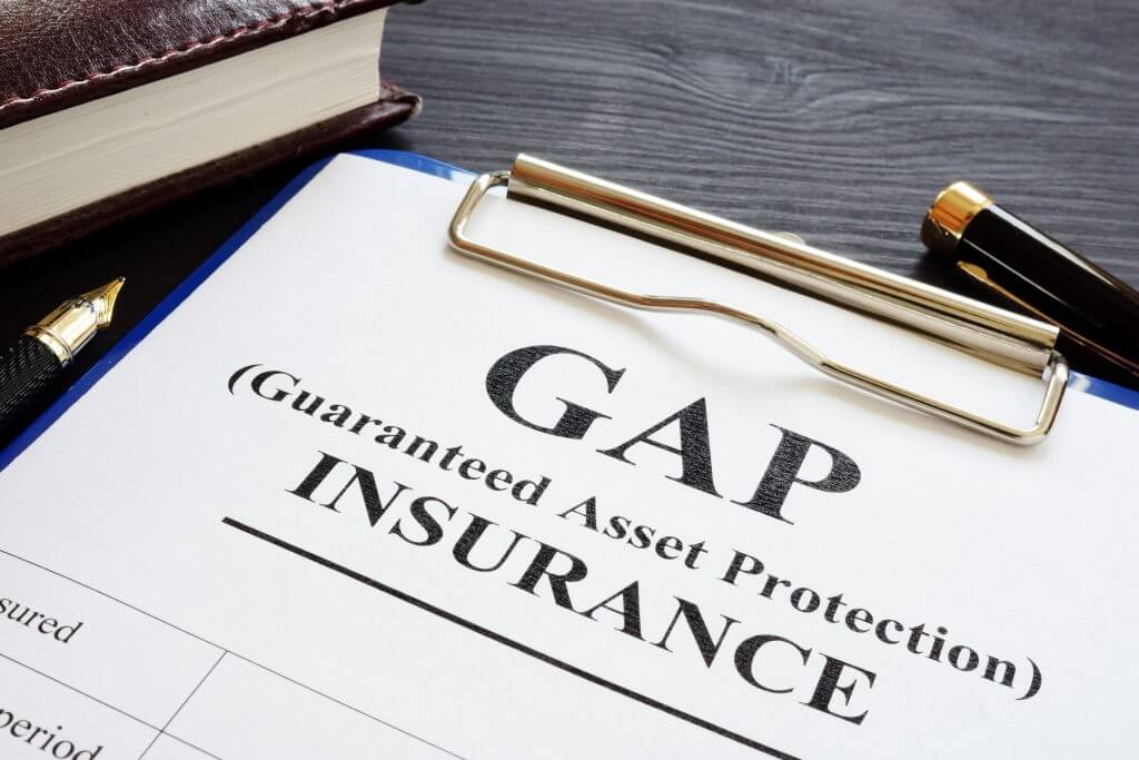 GAP insurance Guaranteed Asset Protection policy and pen.