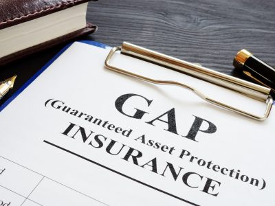 GAP insurance Guaranteed Asset Protection policy and pen.