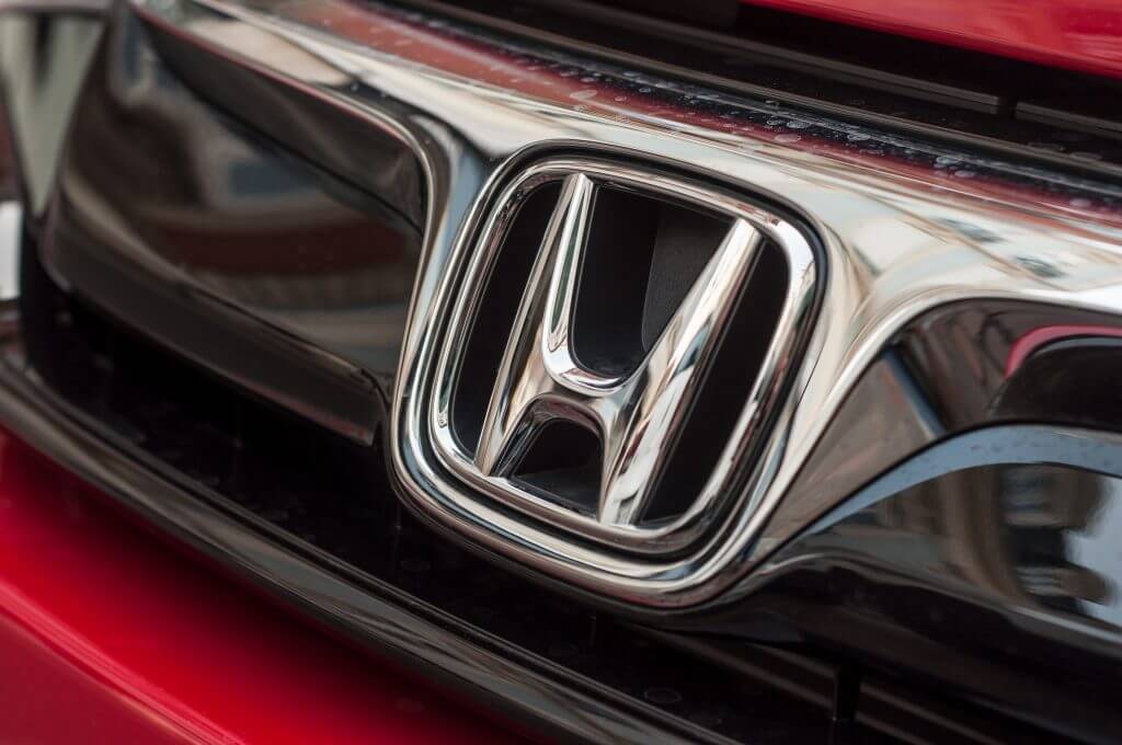 Mulhouse - France - 8 April 2018 - Closeup of Honda logo on red Honda civic car front