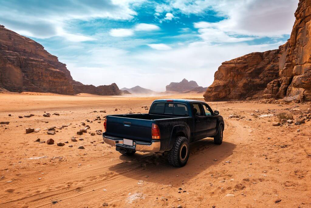 off road car in the red Wadi Rum desert in Jordan
