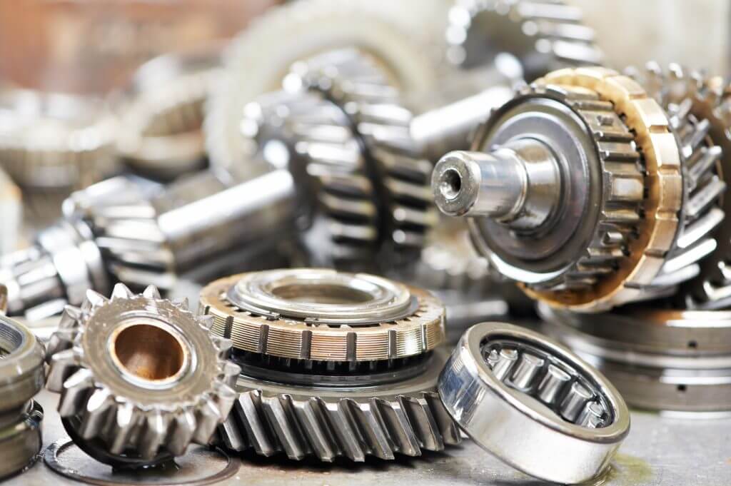 Close-up of automobile engine steel gears and bearings disassembled for repair at car service station