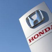 Honda dealership sign against cloudless blue sky