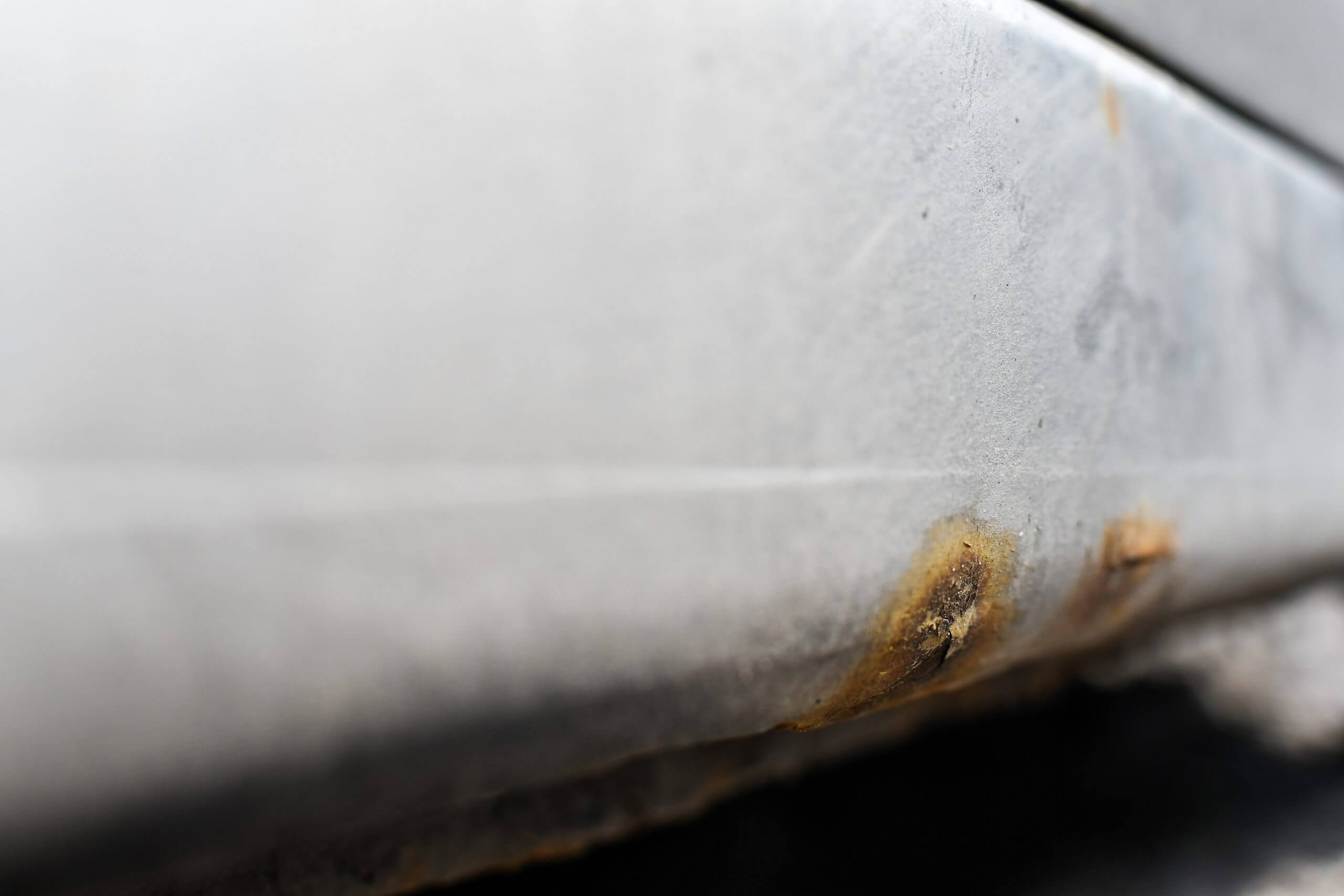 Signs of car corrosion or rust appearing on the bottom of the ca