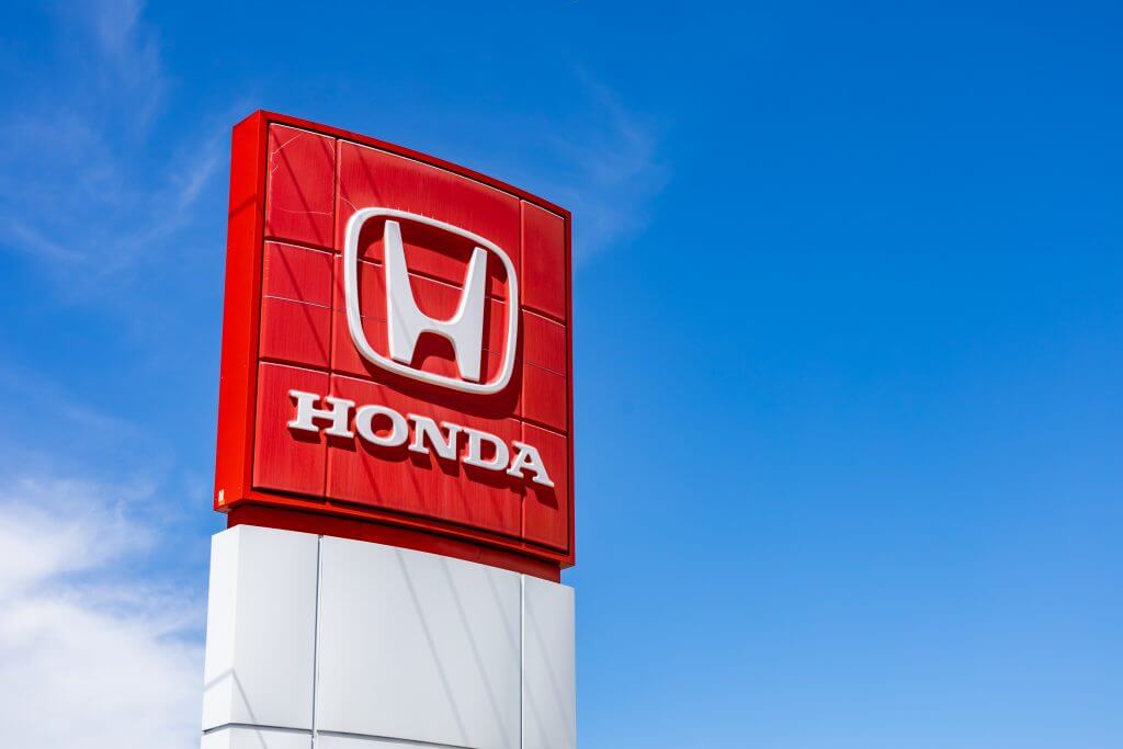 Ottawa, Ontario, Canada - May 31, 2021: The logo for Honda Motor Company (TYO: 7267, NYSE: HMC) on a sign at a car dealership.