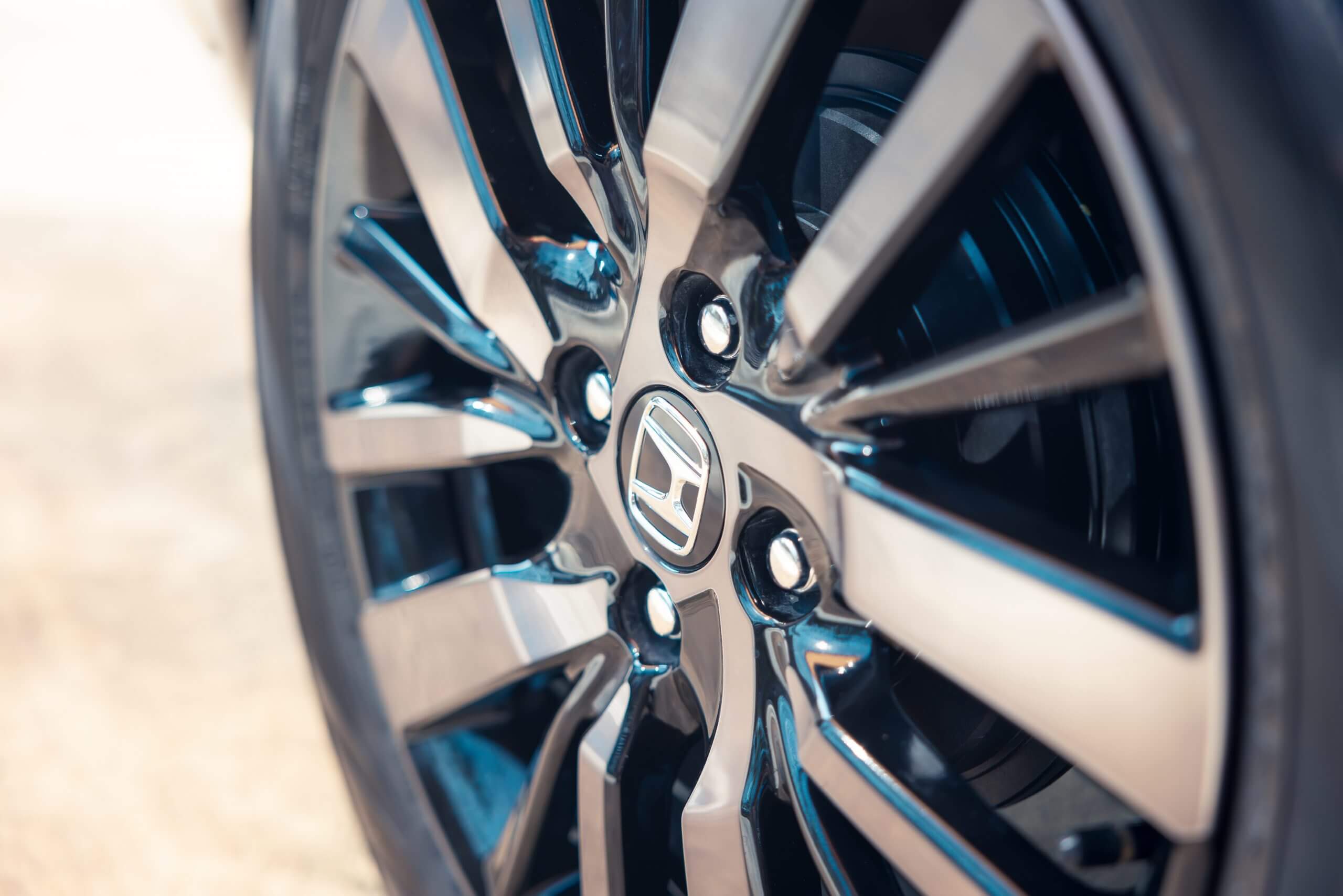 Car alloy wheel with honda icon logo