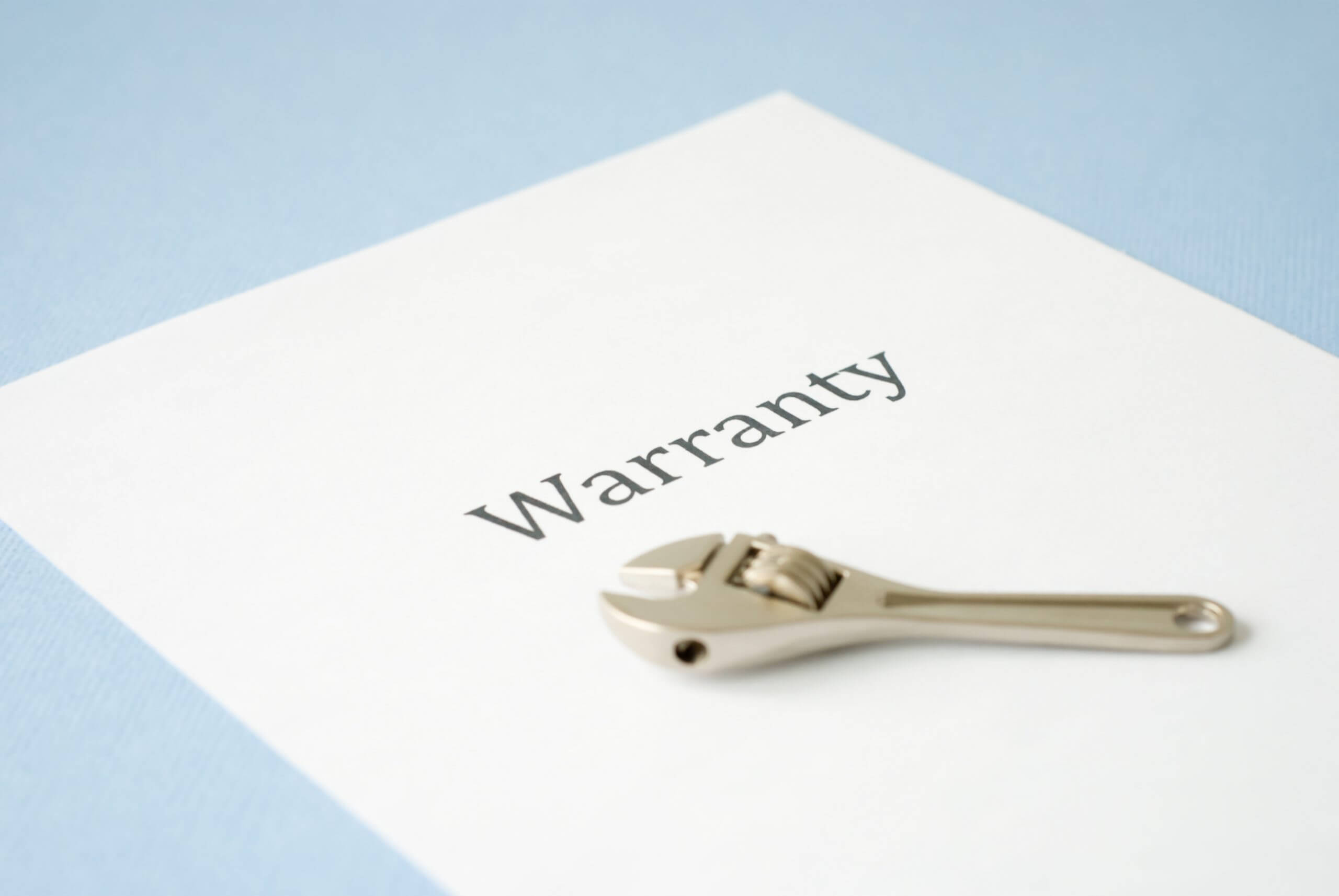 Word "Warranty" printed on a white paper