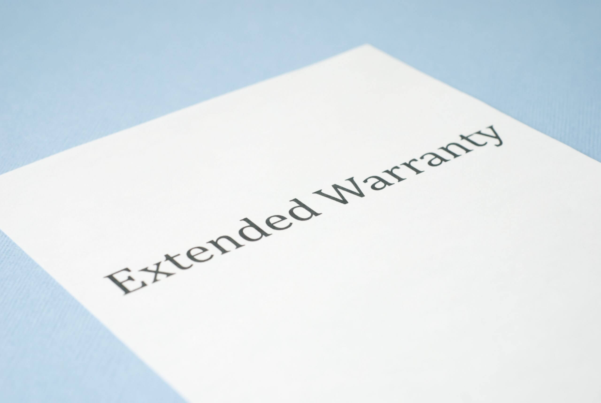 Words " Extended Warranty" printed on a white paper