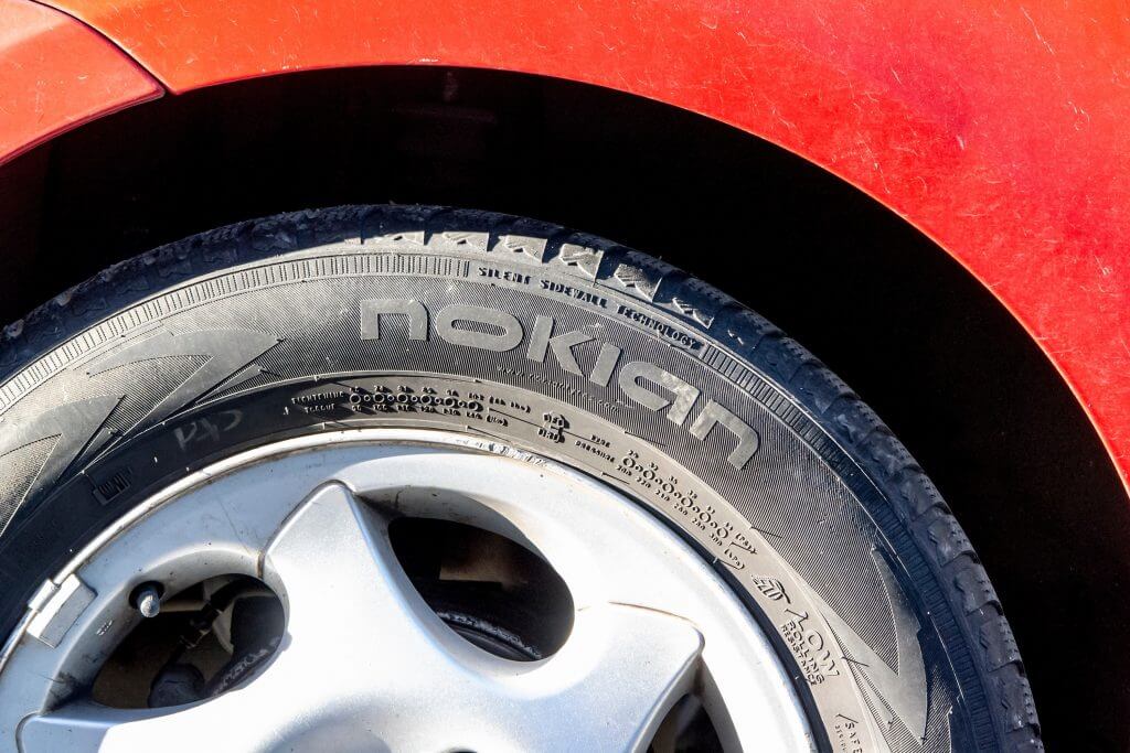 OSTRAVA, CZECH REPUBLIC - MAY 11, 2021: The Nokian rubber tyre mounted on a red car