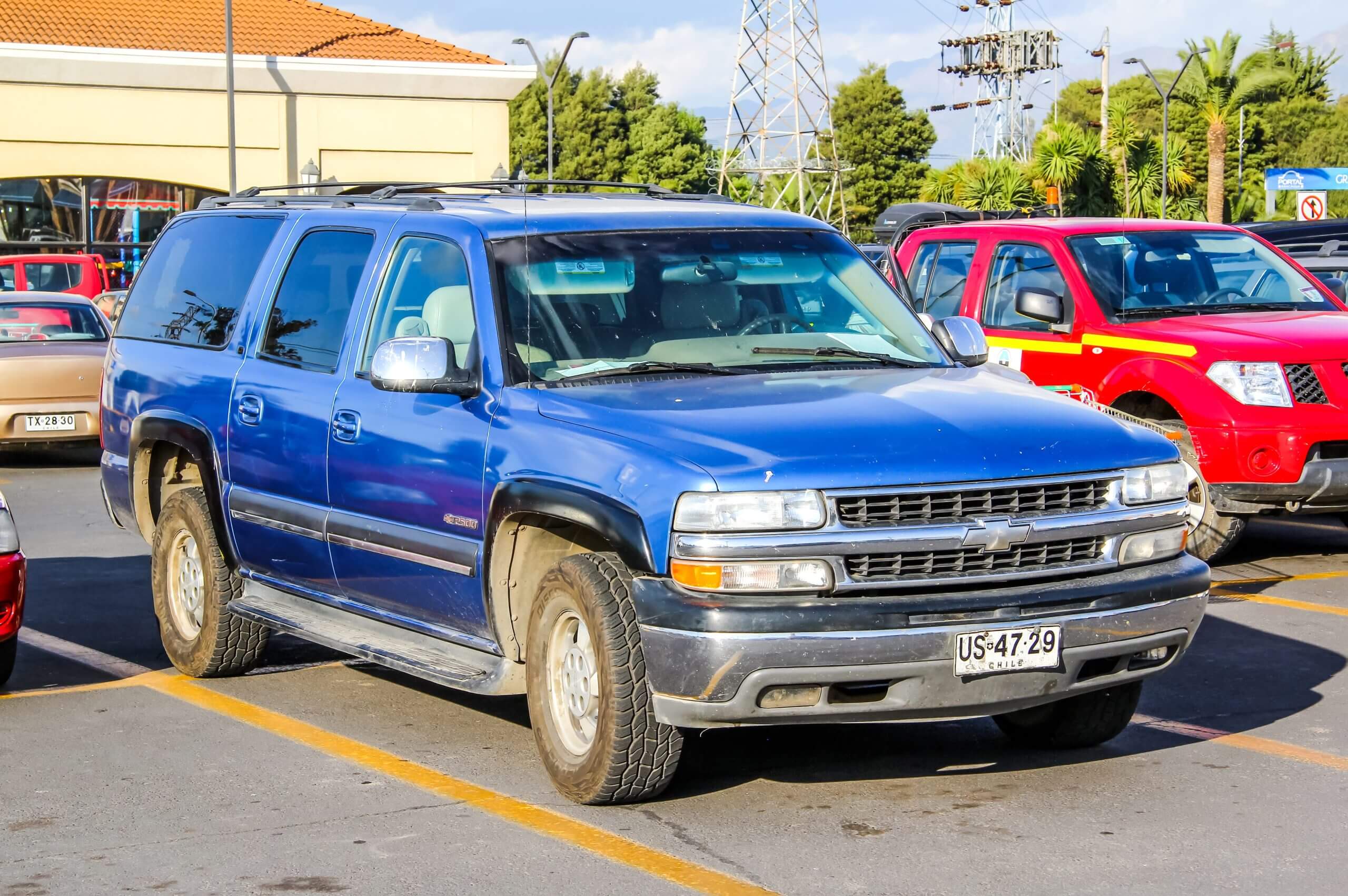 2001 Blue Chevrolet Tahoe in the city street.