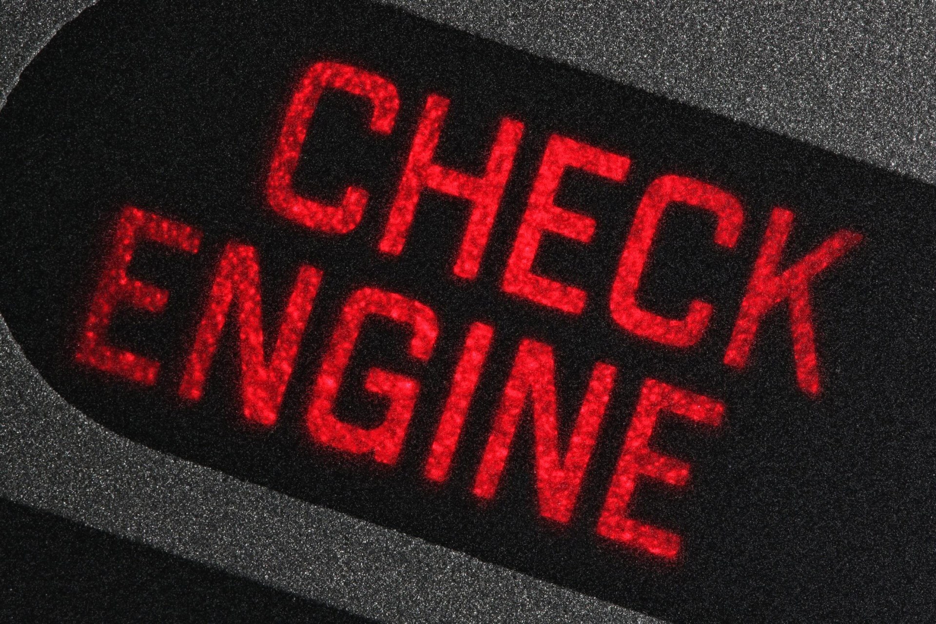 check engine warning light in car dashboard