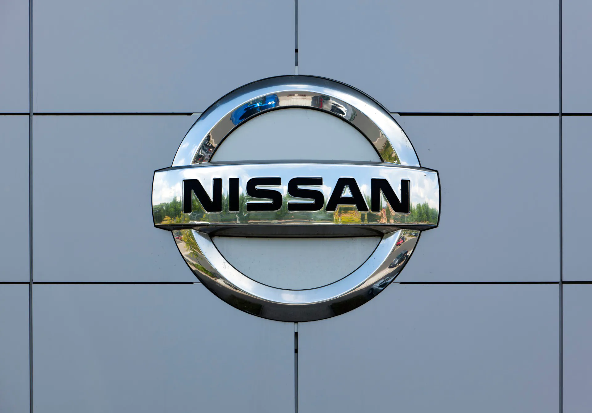 Dusseldorf, Germany - June 12, 2011: Nissan logo at the wall of car dealer's building.