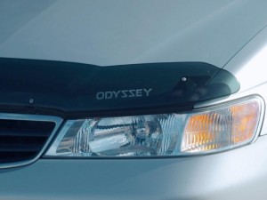 Honda Odyssey hood shield with the word "Odyssey" on it placed just above the headlight
