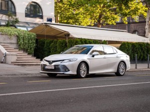 White toyota camry parked on a street