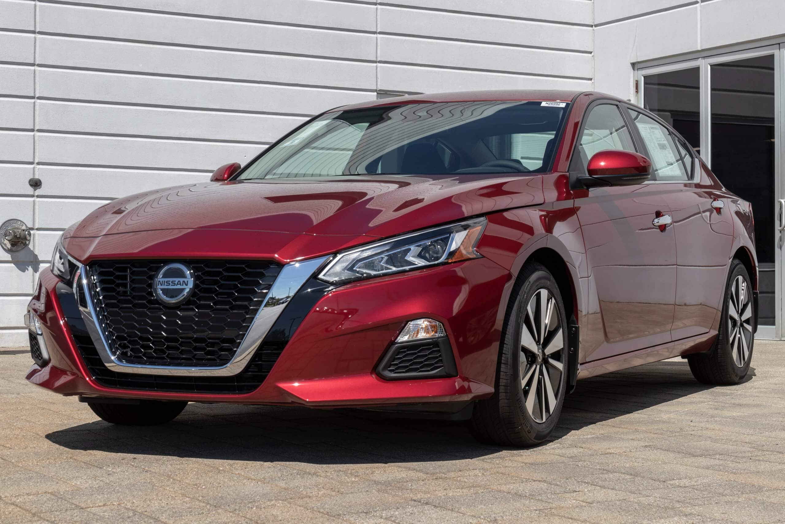 2019 Red Nissan Altima display at a dealership. 