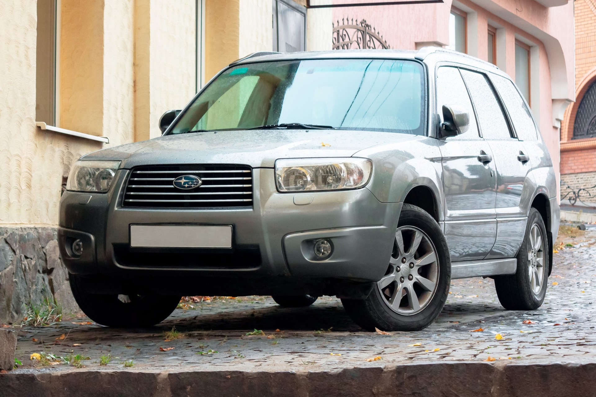 2007 silver Subaru Forester suv parked on the pavement. 