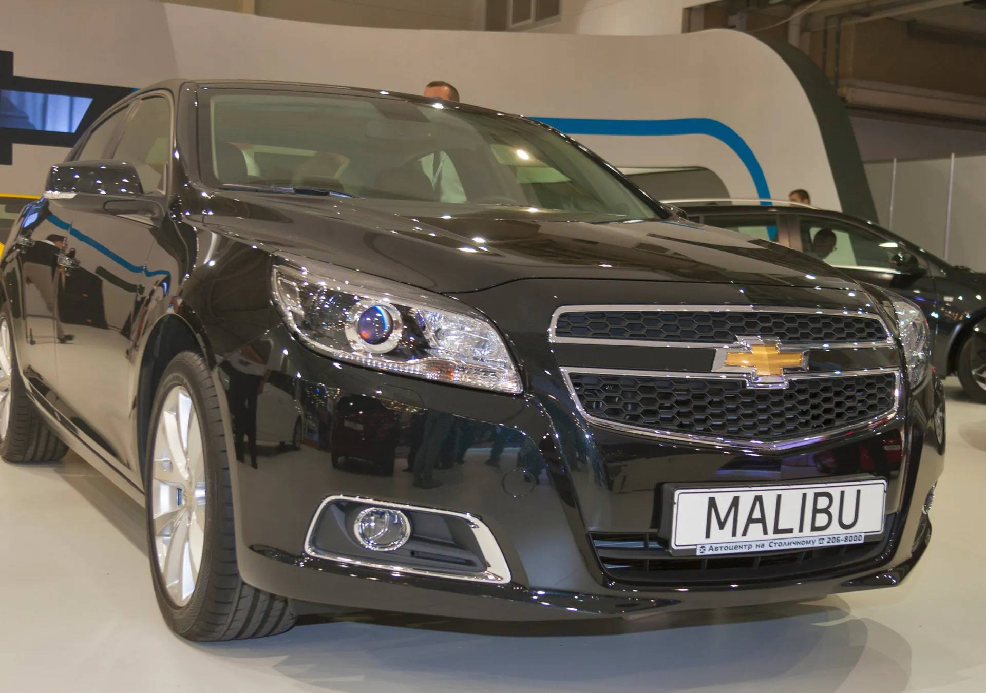 2013 Chevrolet Malibu on display at a car show.