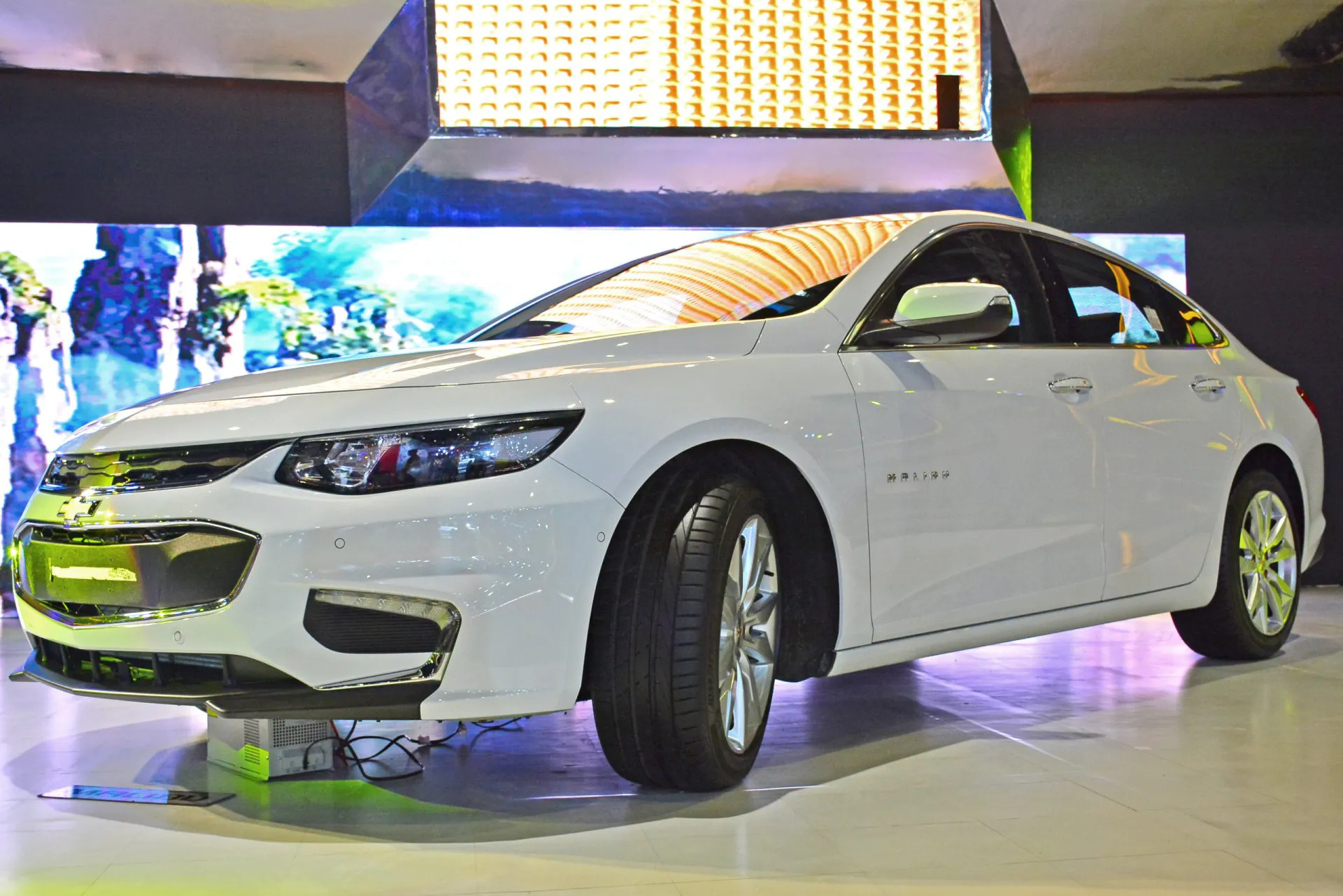 White 2018 Chevrolet Malibu at an Auto Show