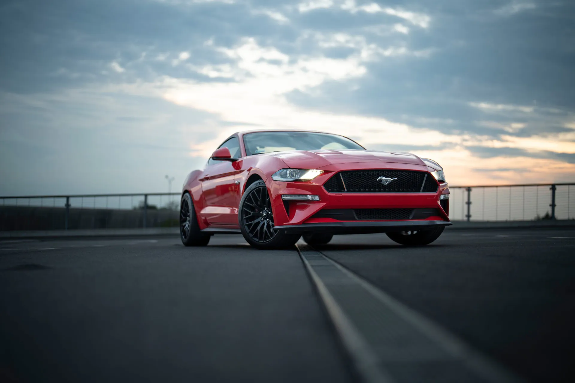 2018 Red Ford Mustang against the skyline