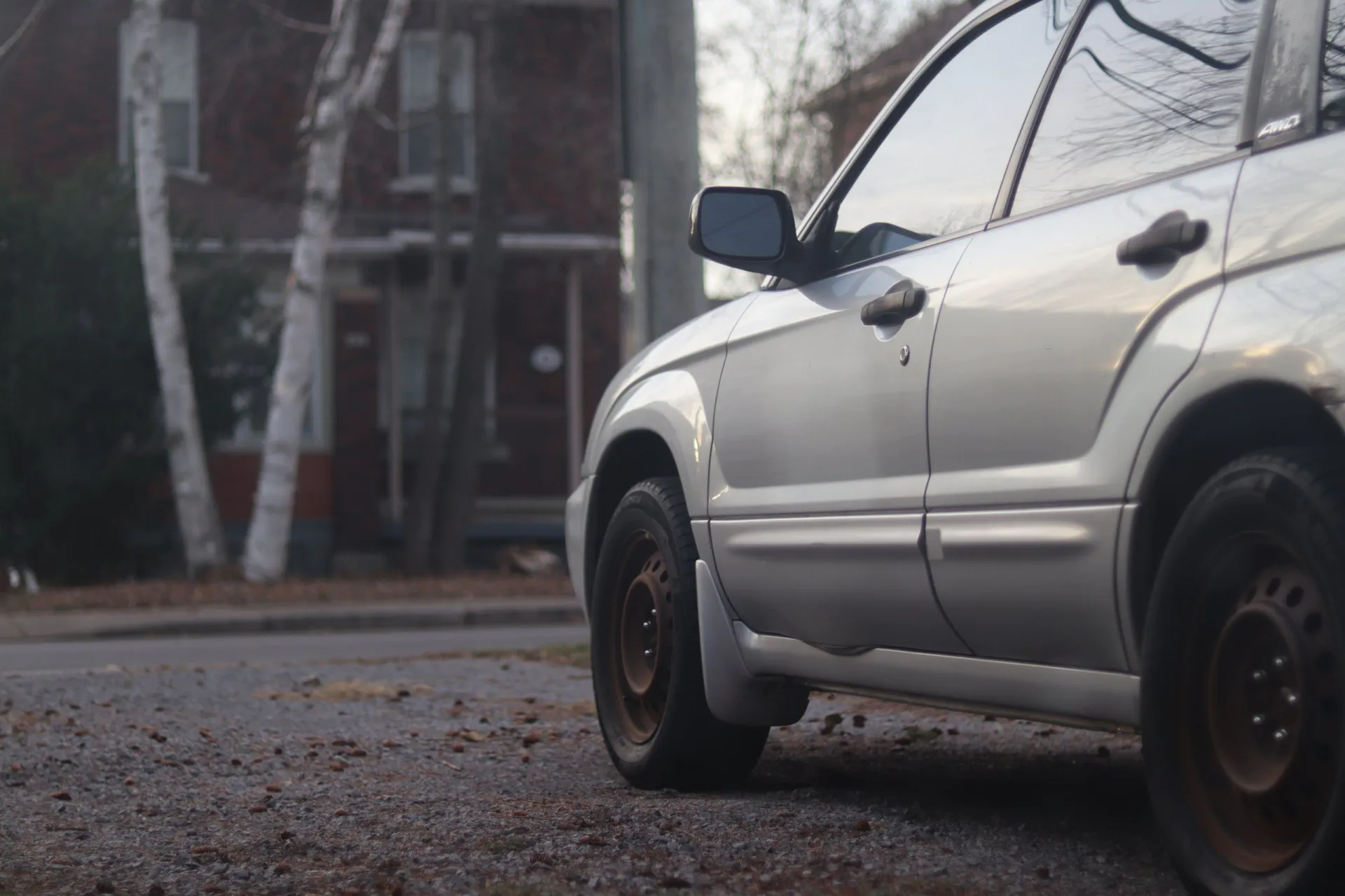 2001 2002 2003 2004 Silver Subaru Forester on gravel with steel wheels