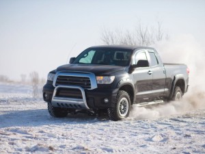 Black Toyota Tundra traveling in the snow