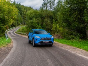 Toyota RAV4 nature background, in motion view.