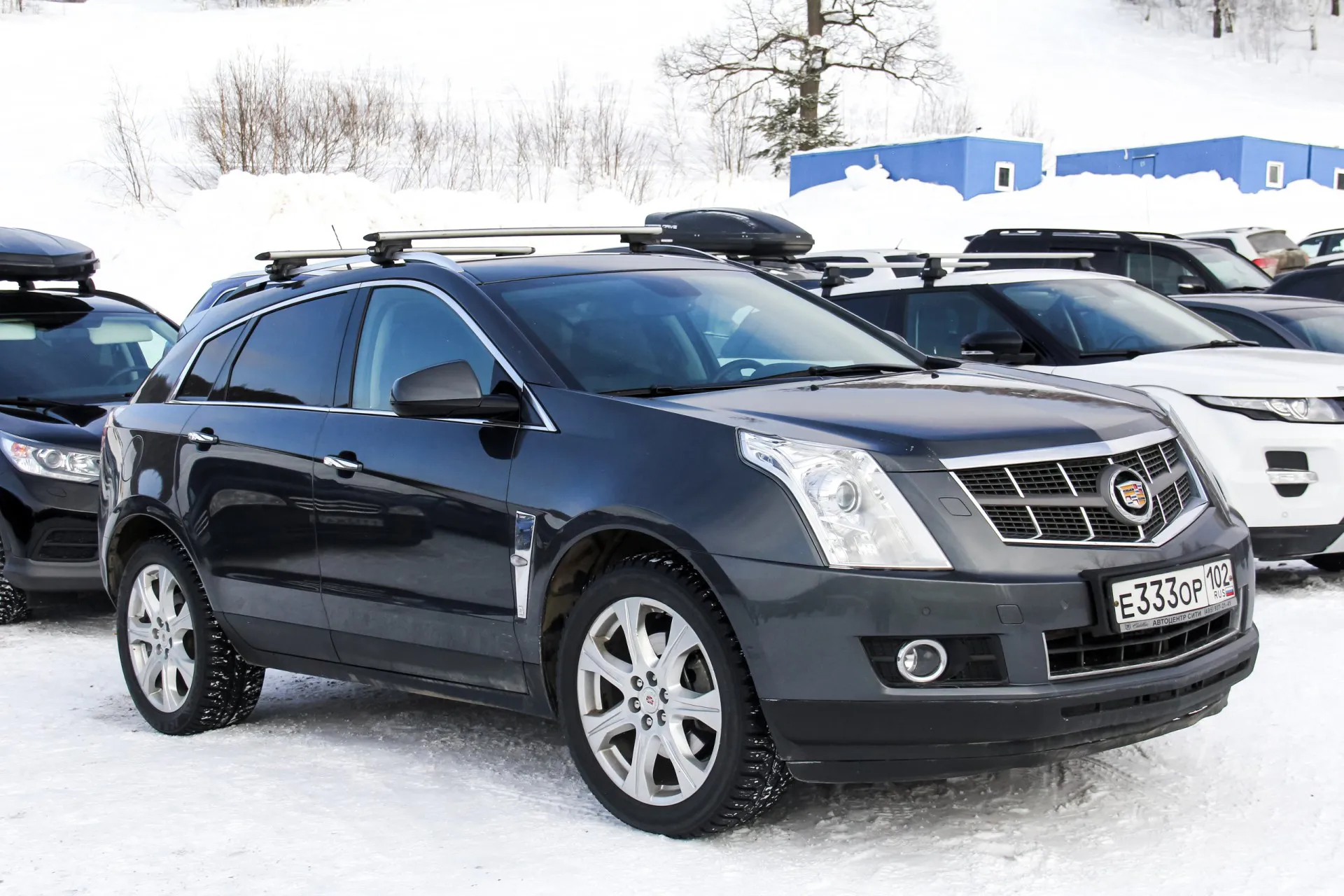 Motor car Cadillac SRX at the countryside.