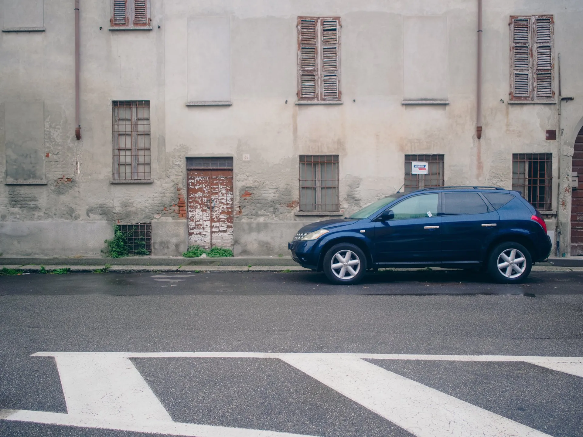 Old Nissan Murano Italian design parked in the street