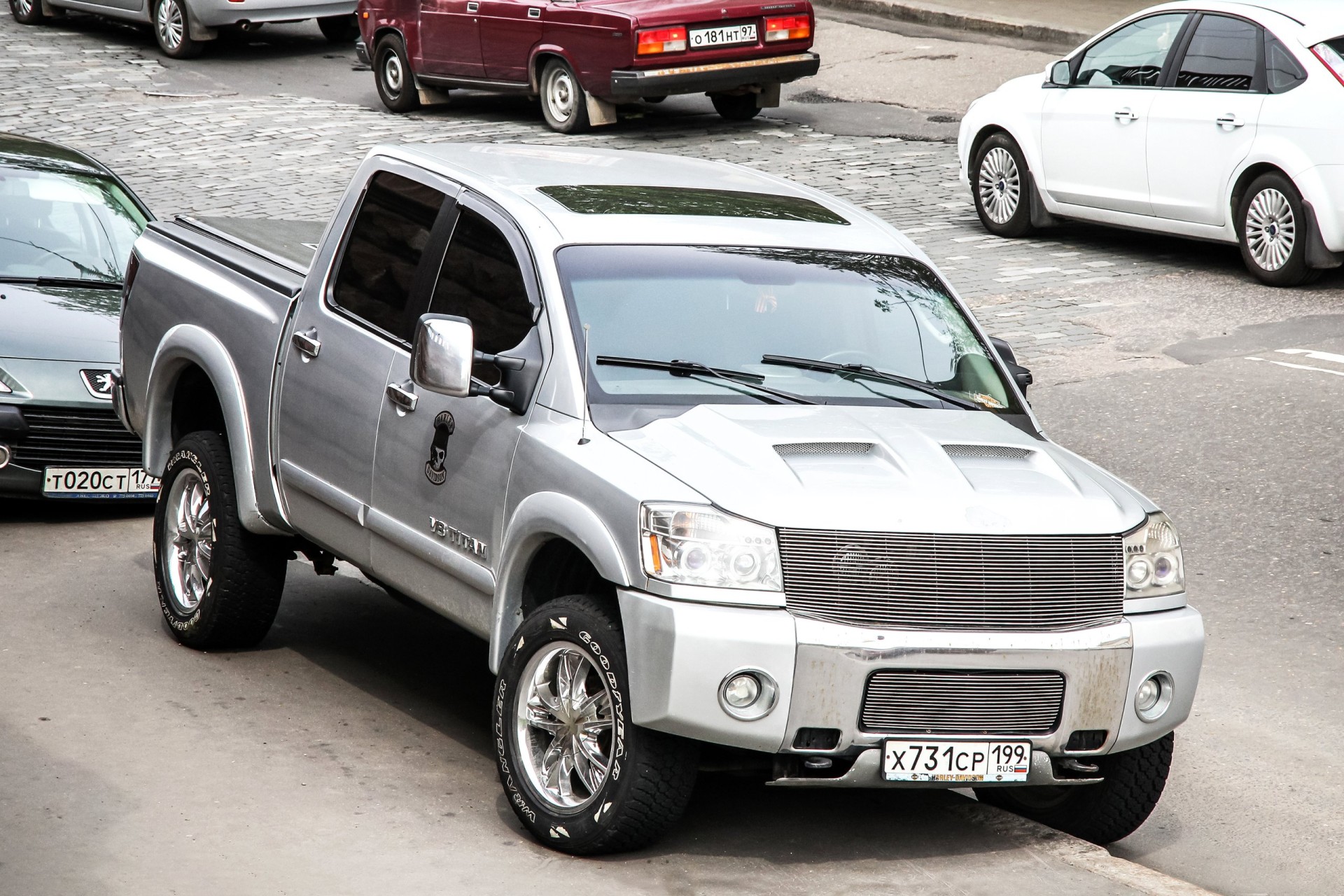 Pickup truck Nissan Titan in the city street.