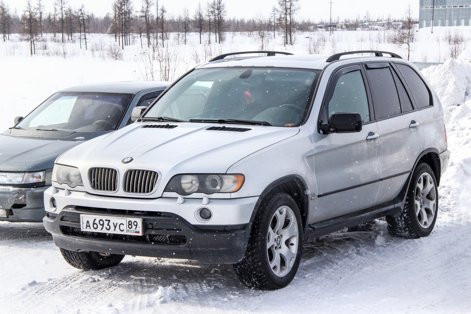 2002 Grey BMW X5 parked on a snowy street