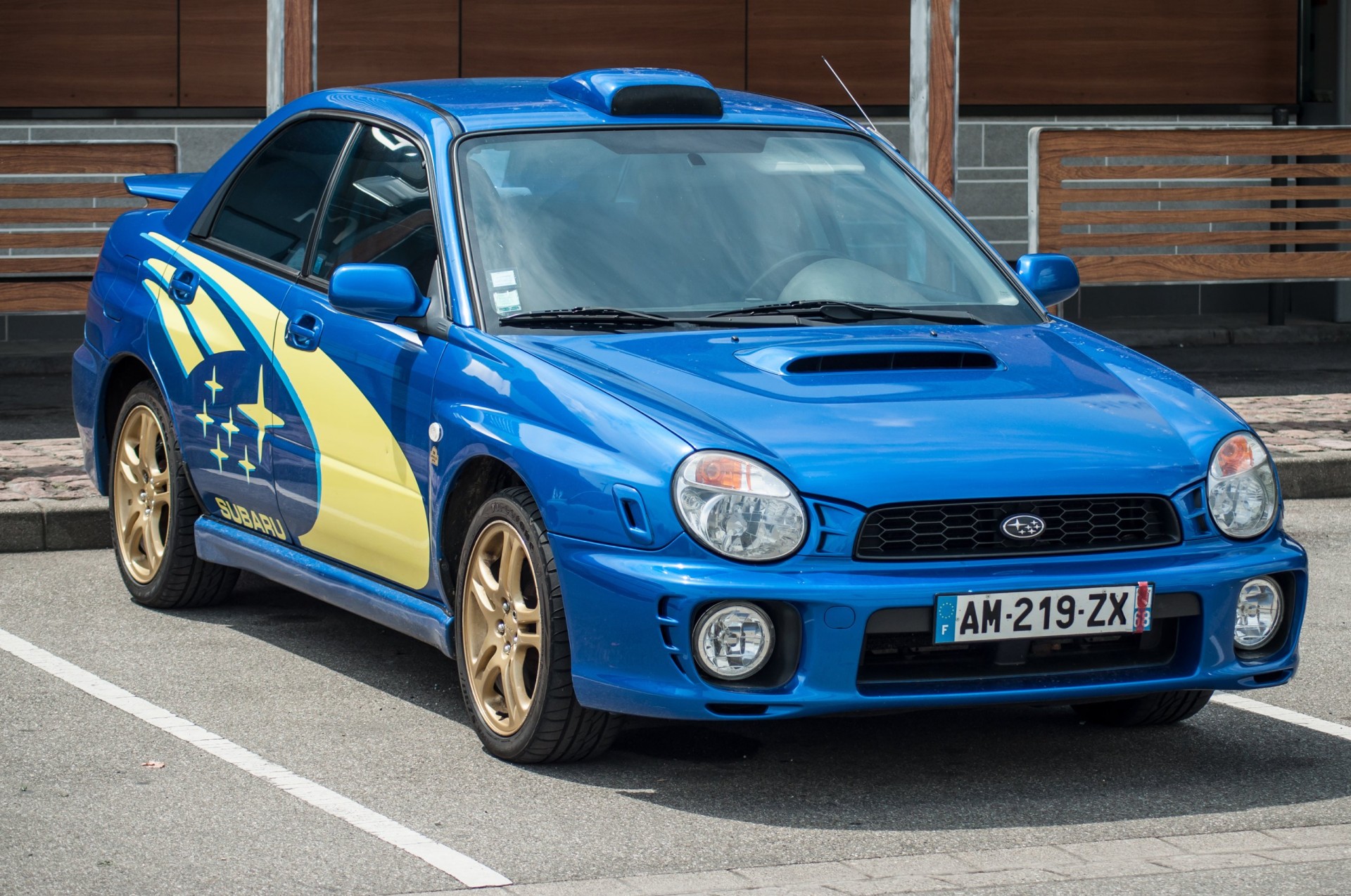 2001 Blue Subaru Impreza parked in the street