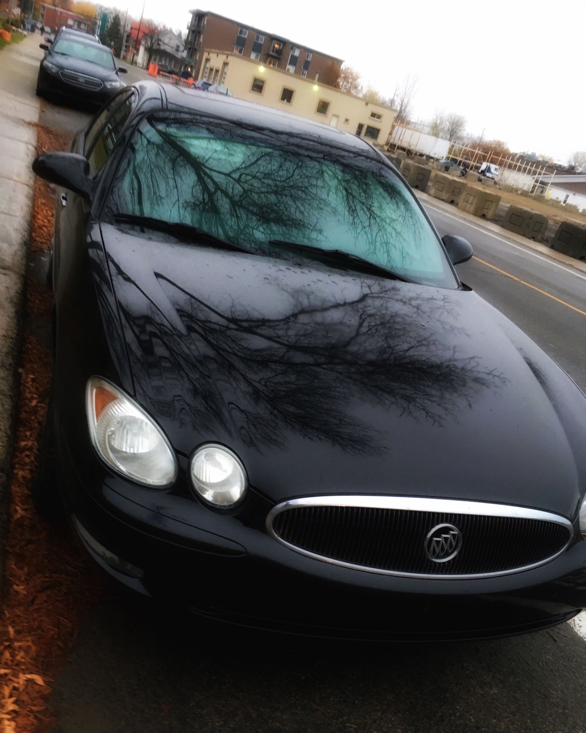 2005 Black Buick LaCrosse parked at the side of the road