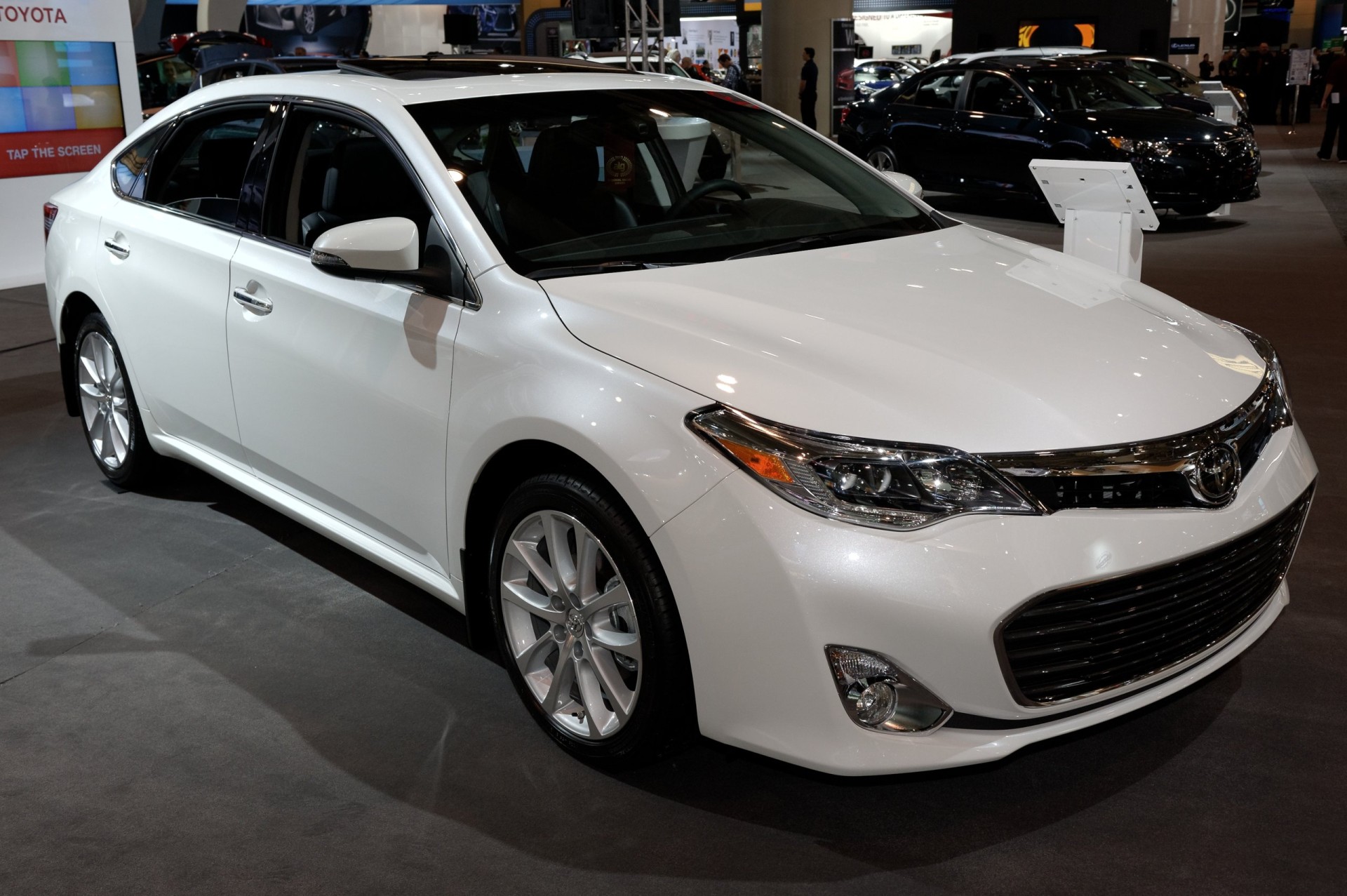 White 2013-2014 Toyota Avalon on display at an auto show