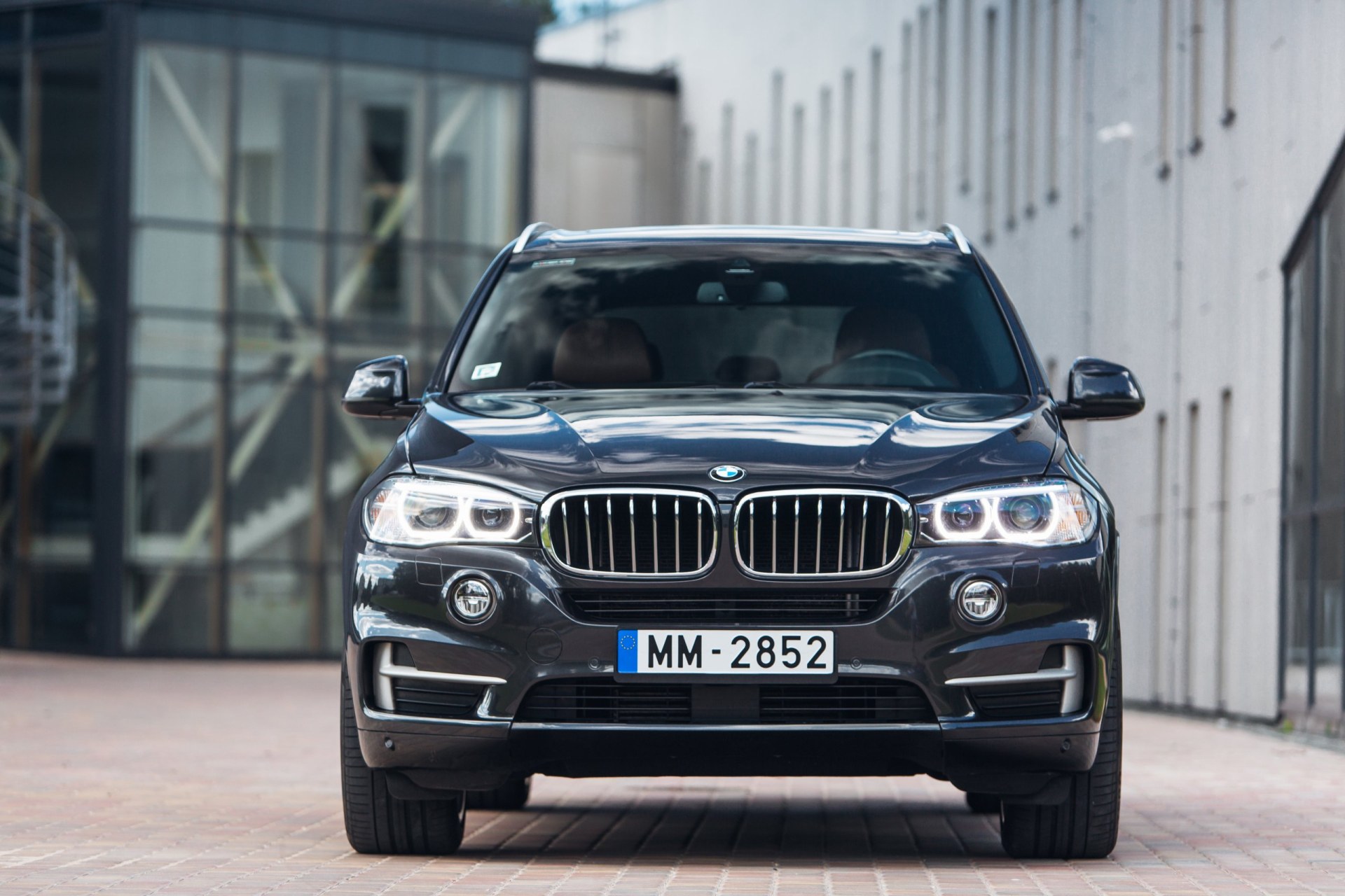 2014 black BMW X5 car parked at a business centre