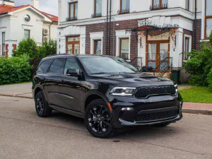 2022 Black Dodge Durango parked on the road in front of a house